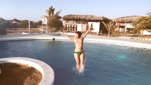 Woman swimming pool plunging Stock Footage