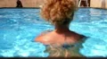 Woman in Swimsuit Swimming in Blue Water Pool. HD Footage
