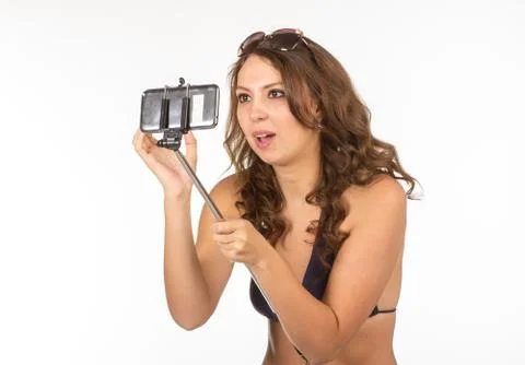 Woman in swimsuits taking a selfie. Stock Photos