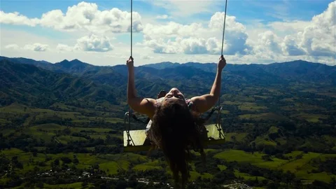 Woman on a swing Stock Footage 76868481