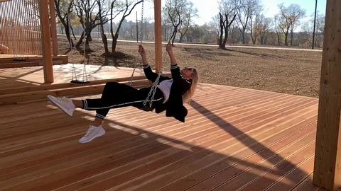Woman on a swing Stock Footage 119653554