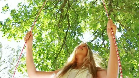 Woman on a swing in slow motion Stock Footage