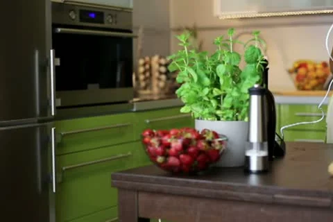 Woman with tablet computer preparing a cake in the kitchen Vídeos de archivo 11614773
