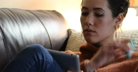 Woman tablet couch - crying Video stock 132057670