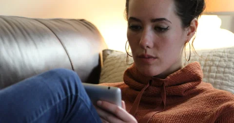 Woman tablet couch - thinking Video stock 132063251