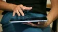A woman with tablet on legs HD Footage