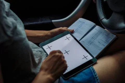 Woman with a tablet looking into Notepad Stock Photos