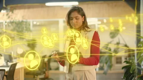 Woman with tablet looking tapping forming yellow nodes and avatars around her Stock Footage 333925455