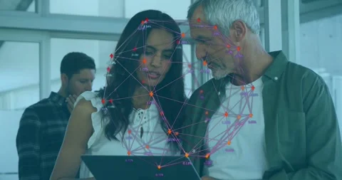 Woman with tablet man leaning tapping while network overlay showing nodes over Stock Footage 334039408