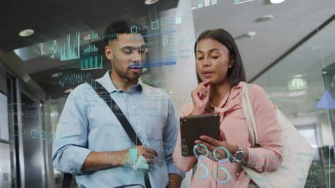 Woman with tablet tapping screen while man pointing, checking business data by Stock Footage 333818265