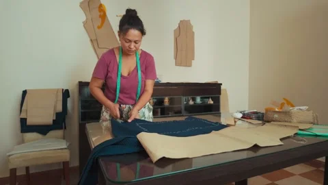 Woman Tailor Cutting Fabric with Pattern for Handmade Clothes Design Stock Footage 346410385