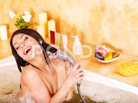 Woman take bubble bath. Stock Photos