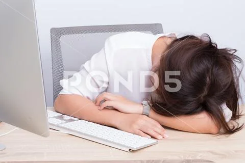 Woman take a nap at office Stock Photos