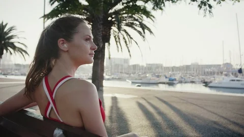 Woman taking a break checking her train programme and schedule on smartphone app Stock-Footage 100421611