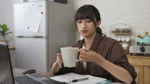 Woman taking a break from work on computer Stock Footage 159007593