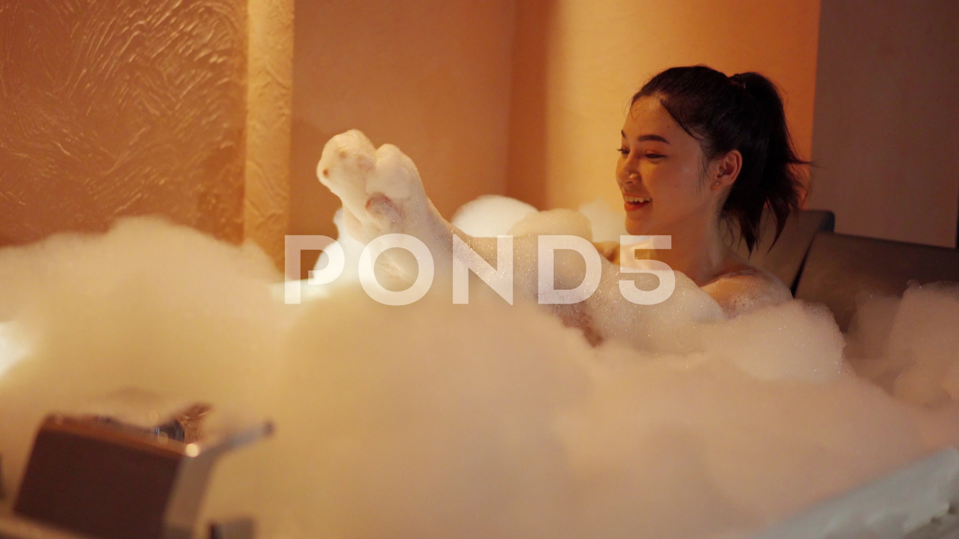 woman taking a bubble bath in the bathtu, Stock Video