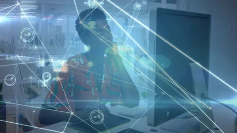 Woman taking call, drawing on tablet while network overlay connecting tablet to Stock Footage 334312062