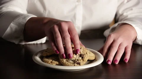 Woman taking a cookie Video stock 41881409