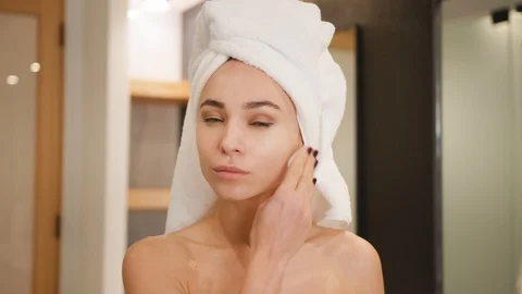 Woman taking off makeup Stock Footage 101484048