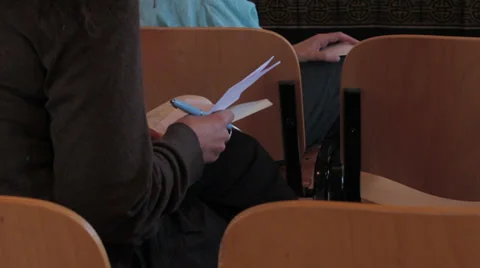 Woman is taking notes by hand on block notes: conference, audience, press Stock Footage 28204431
