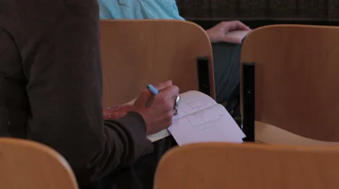 Woman is taking notes by hand on block notes: conference, audience, press Stock Footage 28204748