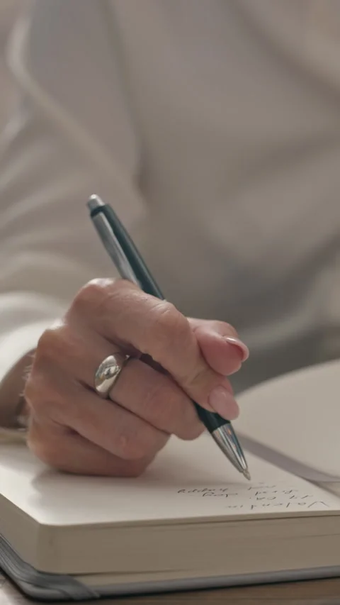 Woman Taking Notes in Notebook during Psychology Session Stock Footage 340626979