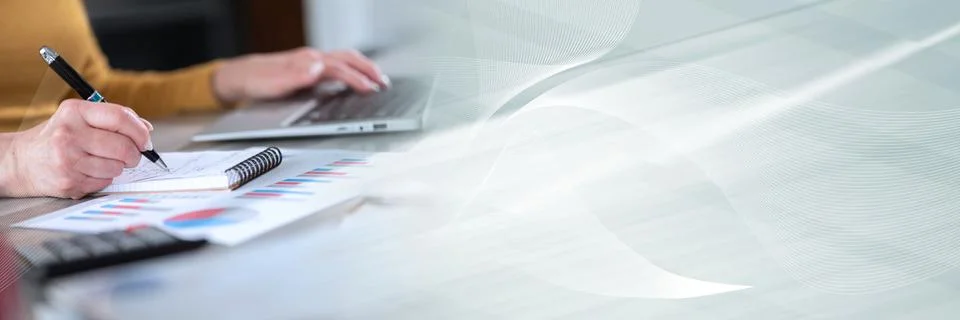 Woman taking notes while using laptop; panoramic banner Stock Photos