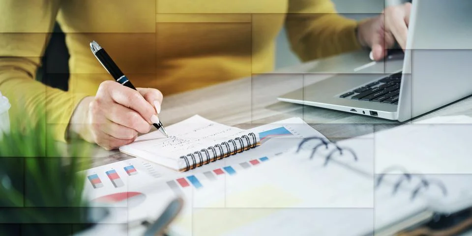 Woman taking notes while using laptop, geometric pattern Stock Photos