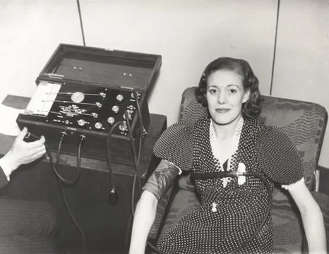 Woman taking a polygraph test Stock Photos