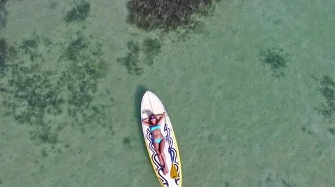 Woman taking rest paddleboarding on SUP on Samui Thailand standing Video stock 59109117