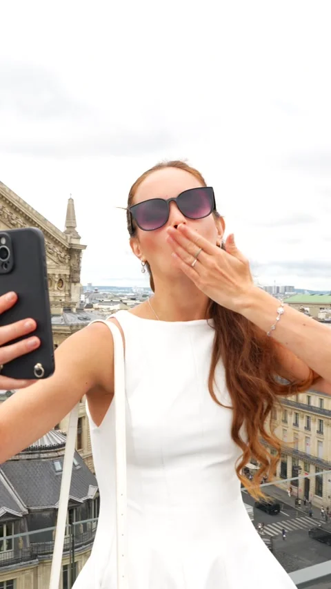 Woman taking selfie with Eiffel Tower view in Paris Stock Footage 314980122