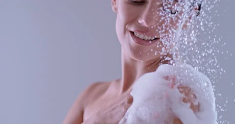 Woman taking a shower Stock Footage