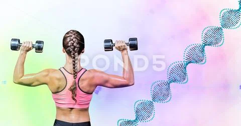 Woman taking weight with DNA draw against green and pink lights Stock Photos