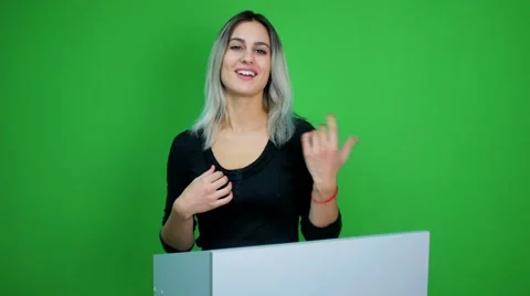 Woman talk at podium at green screen background Stock Footage