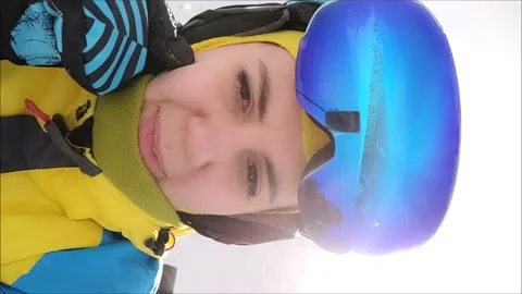 Woman talking on camera while skiing Stock Footage 163229884