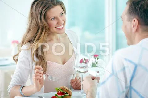 Woman talking to her boyfriend in cafe Stock Photos