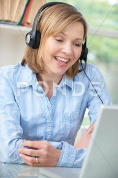 Woman Talking Online Wearing Headset