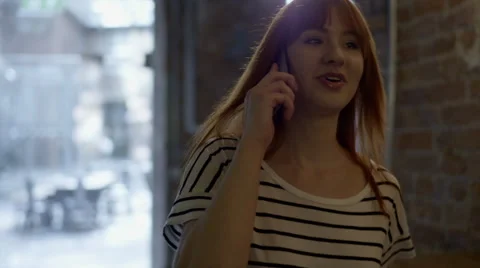 Woman talking on phone Stock Footage