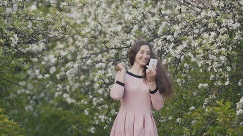 The woman is talking on the phone Stock Footage