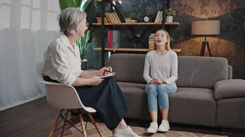 Woman talks about relationship problems with psychologist Stock Footage 218636566