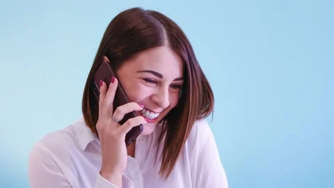 Woman talks using smartphone Stock Footage 152095354