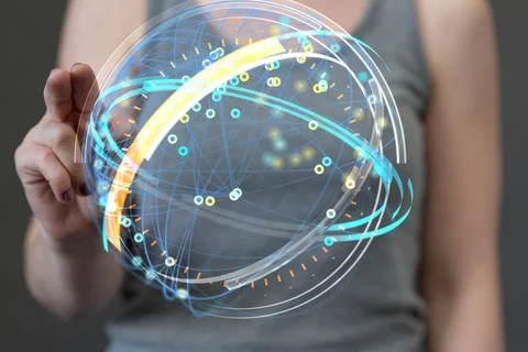 Woman tapping on a 3D rendering of a globe hologram with interconnected dots Stock Photos