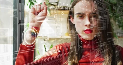 Woman tapping circular data node after raising hand in home AR, revealing Stock Footage 329920848
