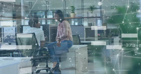 Woman tapping desk opening folder asking man swiveling reviewing business docs Stock Footage 309722456