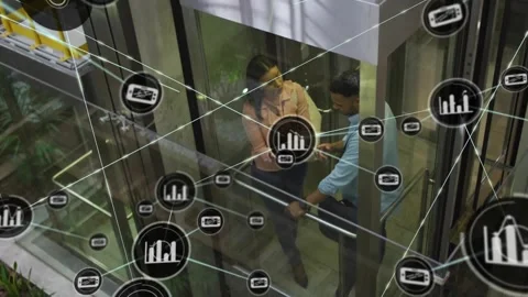Woman tapping device, explaining analytics to coworker in glass elevator, graph Stock Footage 329786200