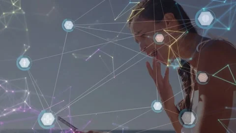 Woman tapping handheld device starting tech network overlay, hex nodes Stock Footage 333975715