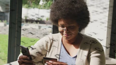 Woman tapping phone and checking card at door, causing data overlay to verify Stock Footage 333351495