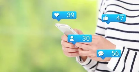 Woman tapping phone, causing animated social media icons heart likes chat, Stock Photos