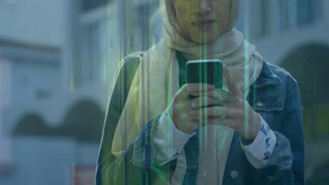 Woman tapping phone screen at storefront glass causing shifting green streaks Stock Footage 332746939