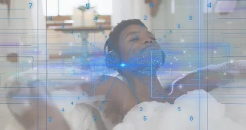 Woman tapping play button in bath generating blue digital overlay pulsing around Stock Footage 318776314